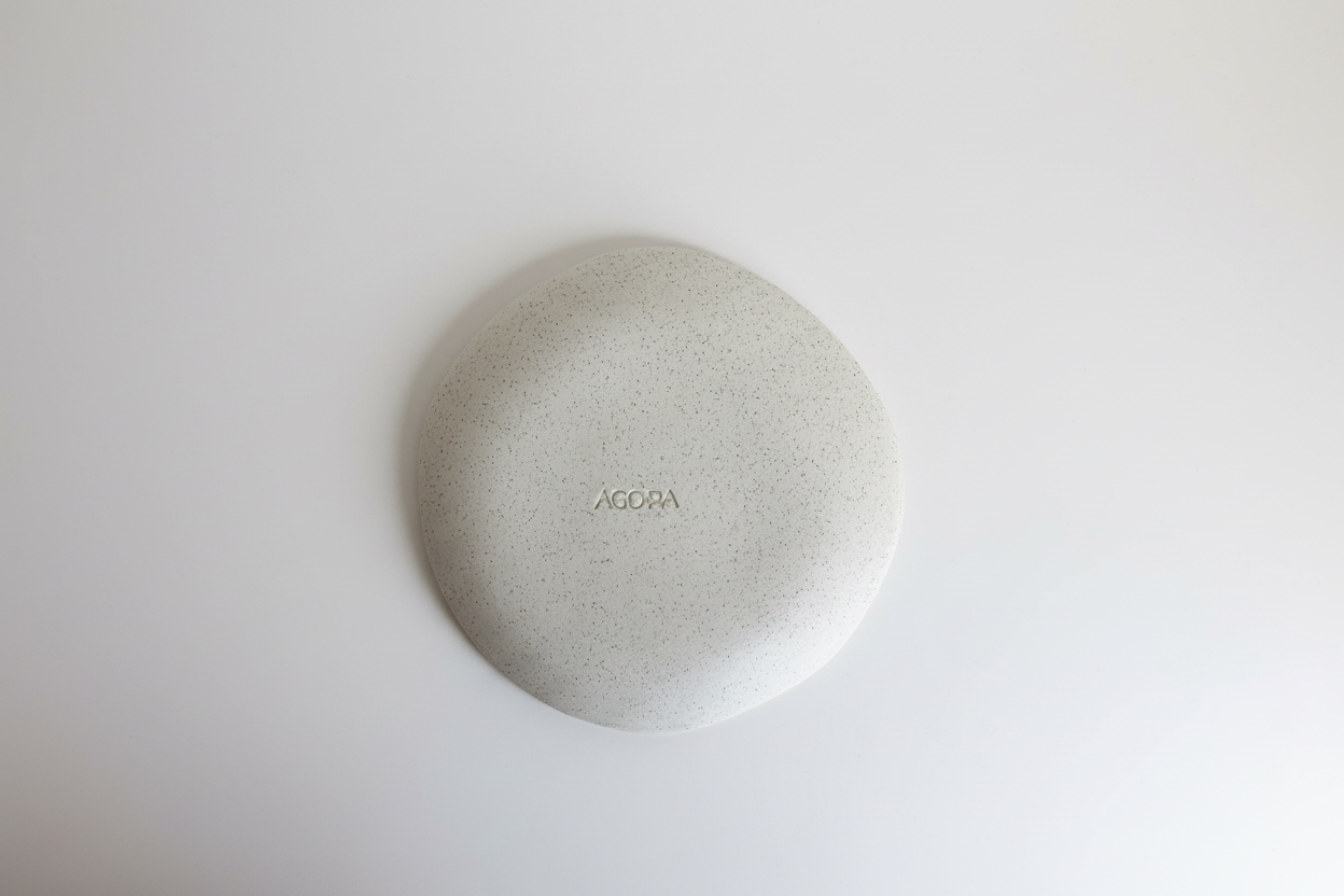 Ceramic plate with Agora branding and neutral white background - Image 8