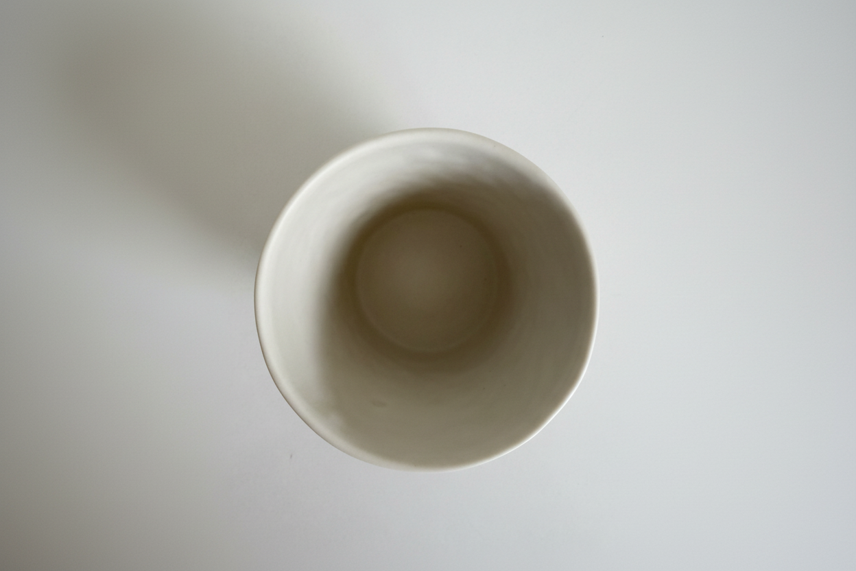 Paxos cup bottom with Agora branding and neutral white background - Image 5