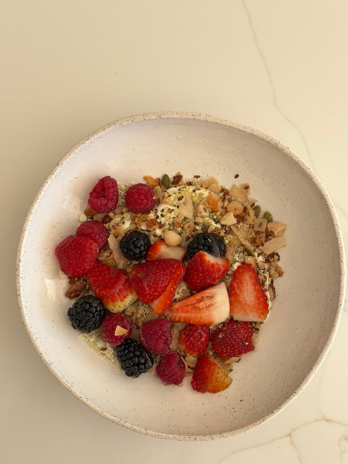Petra Bowl served with yoghurt, granola and fresh berries