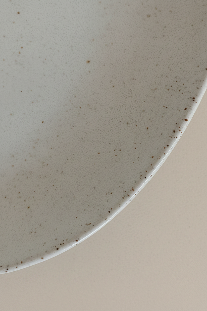 Three stacked plates top view – warm white background